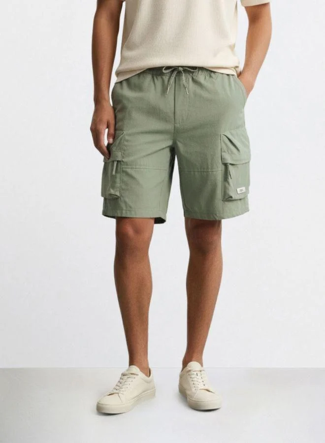 The Indian Garage Co Men Relaxed Fit Solid Cargo Pocket Mid-Rise Cargo Shorts